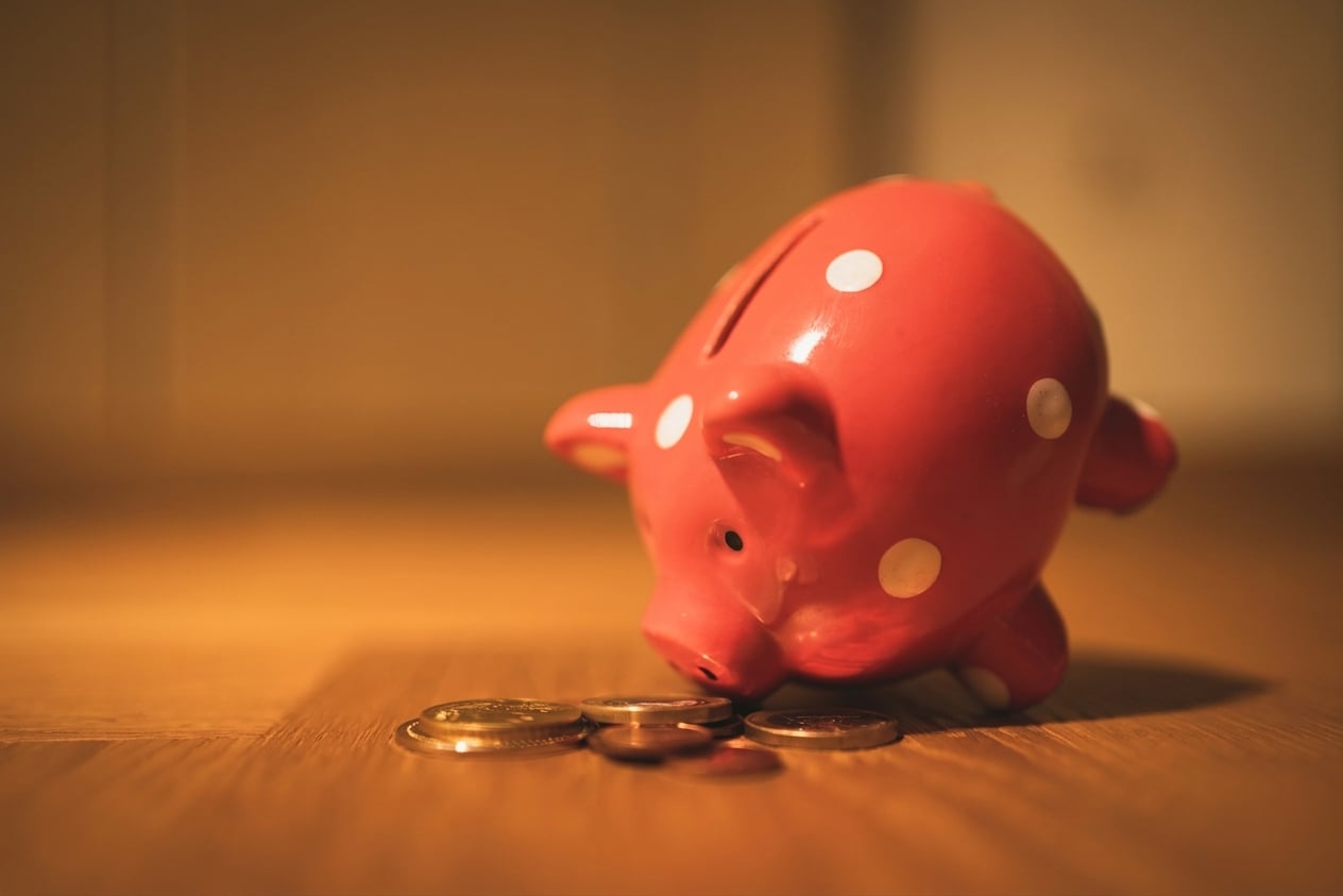 piggy_bank_with_coins_around_it.jpg