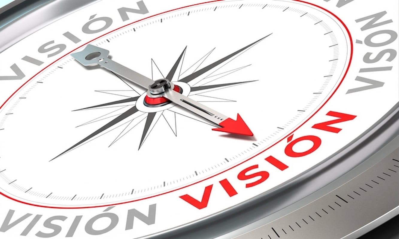 Foto de una brújula apuntando a la palabra vision