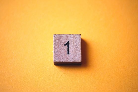 An image of the number one on an orange background