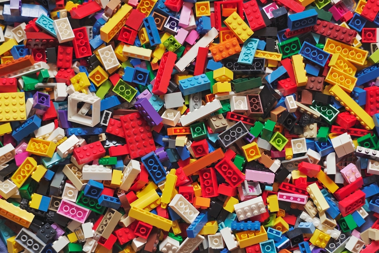 A visual of a heap of disarranged lego blocks
