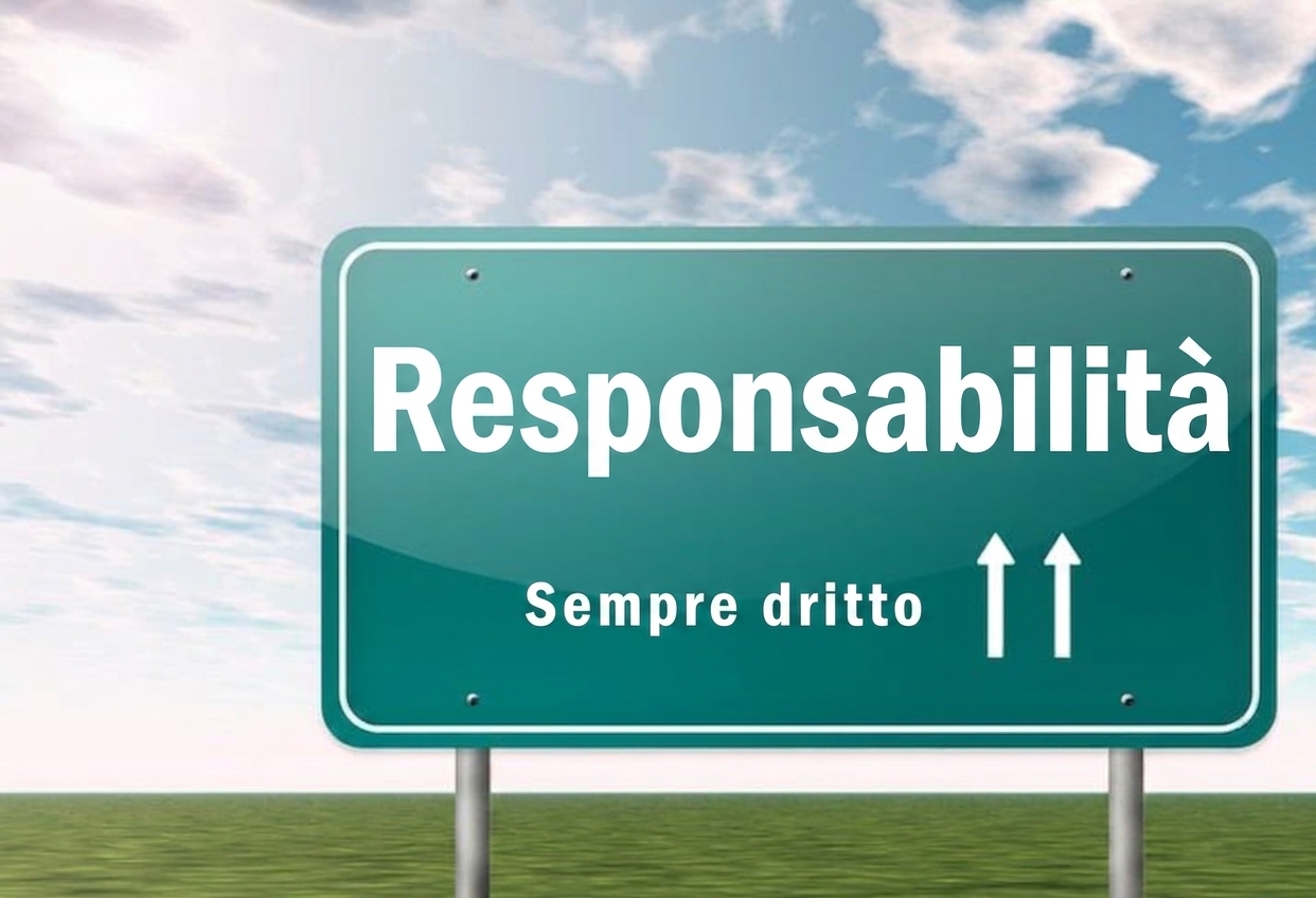 Un cartello stradale con scritto responsabilità più avanti