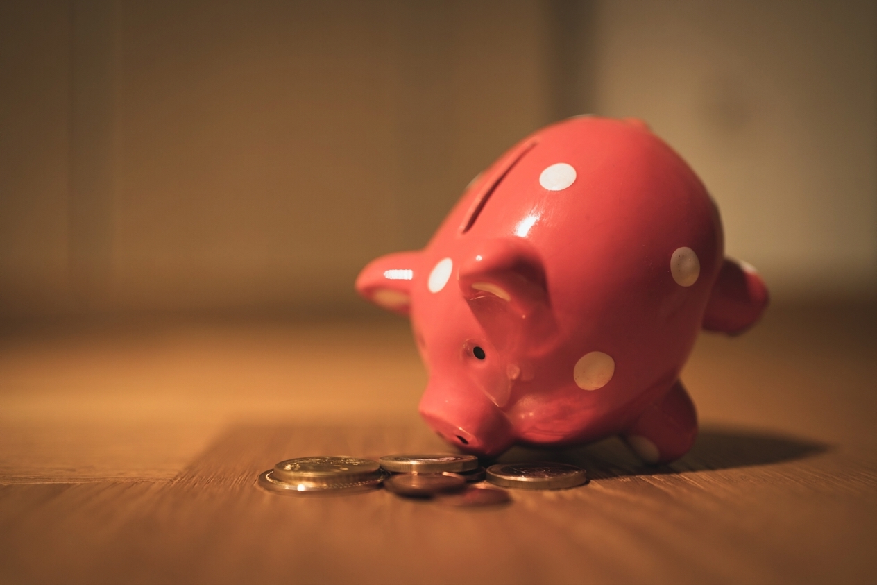 piggy_bank_with_coins_around_it.jpg