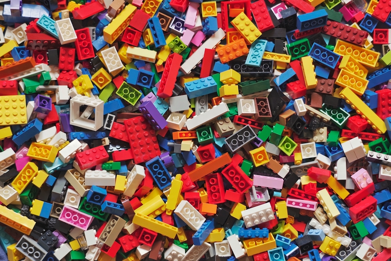 A visual of a heap of disarranged lego blocks