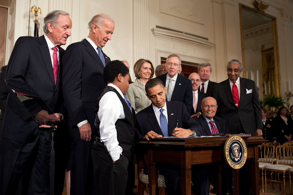 Barack Obama signs the Patient Protection and Affordable Care Act at the White House, March 23, 2010