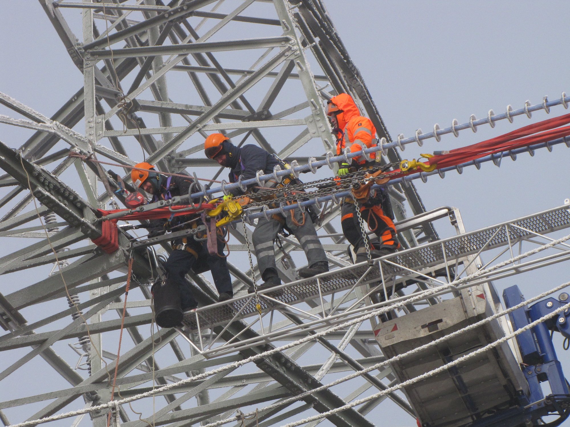 Power grid maintenance engineers on their daily work