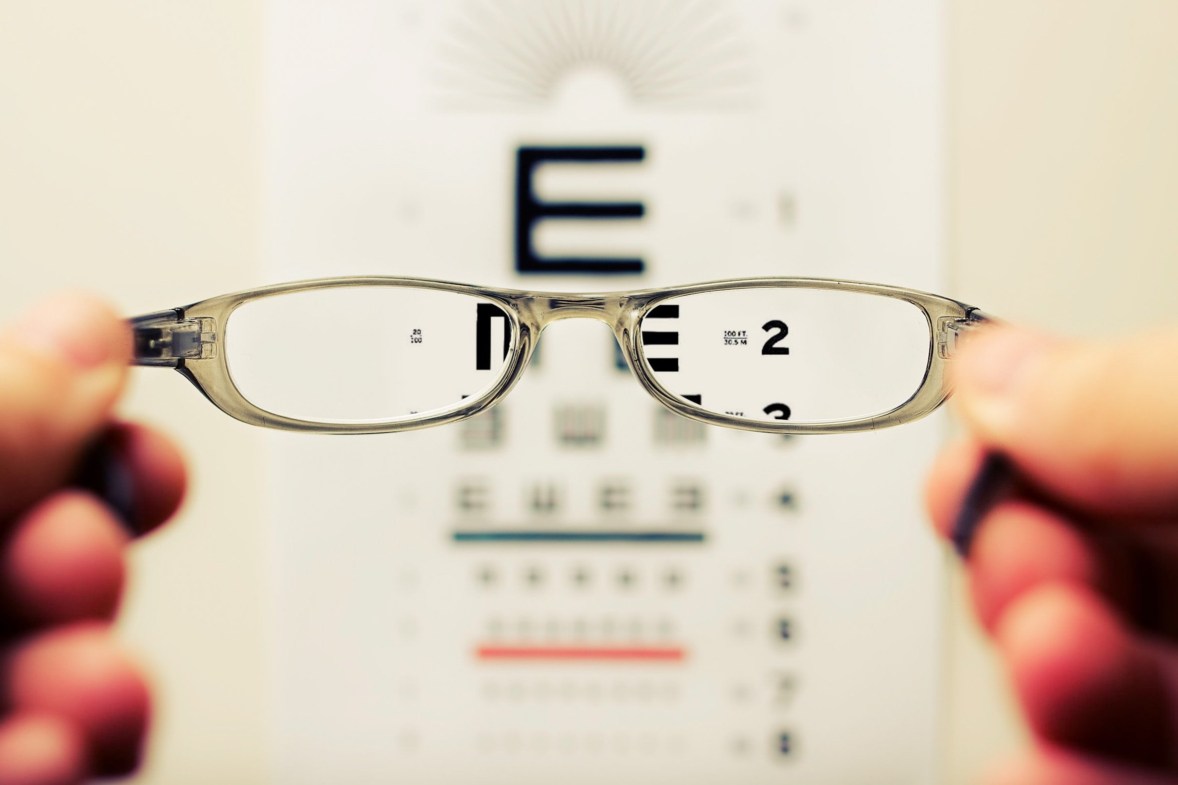 Eye glasses looking at eye chart