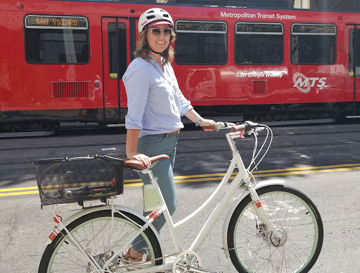 Cody next to her bike