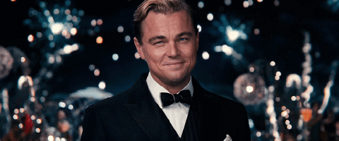 Gif of Leonardo Dicaprio raising a glass in sign of congratulations and celebration