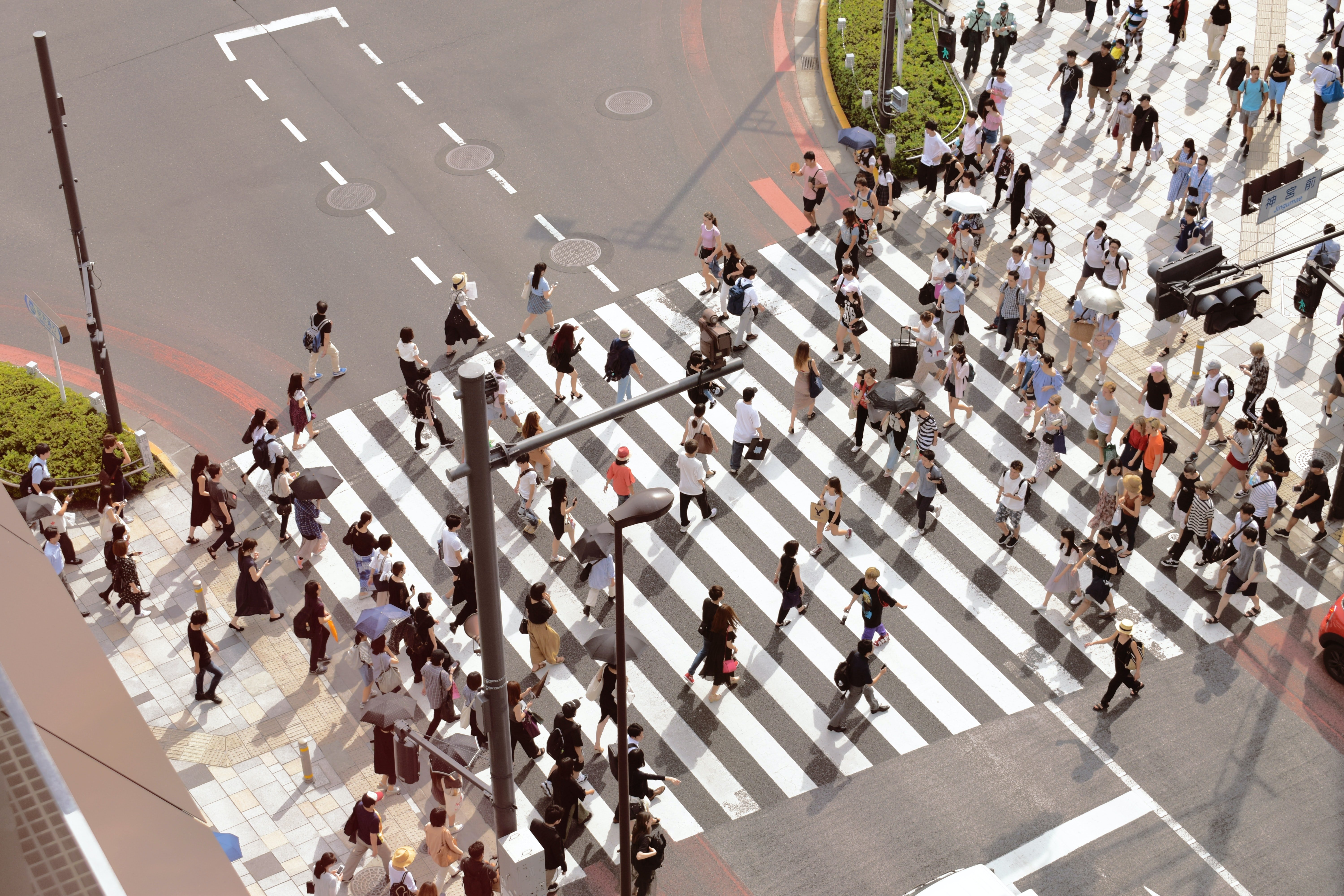 A large group of people crossing a street