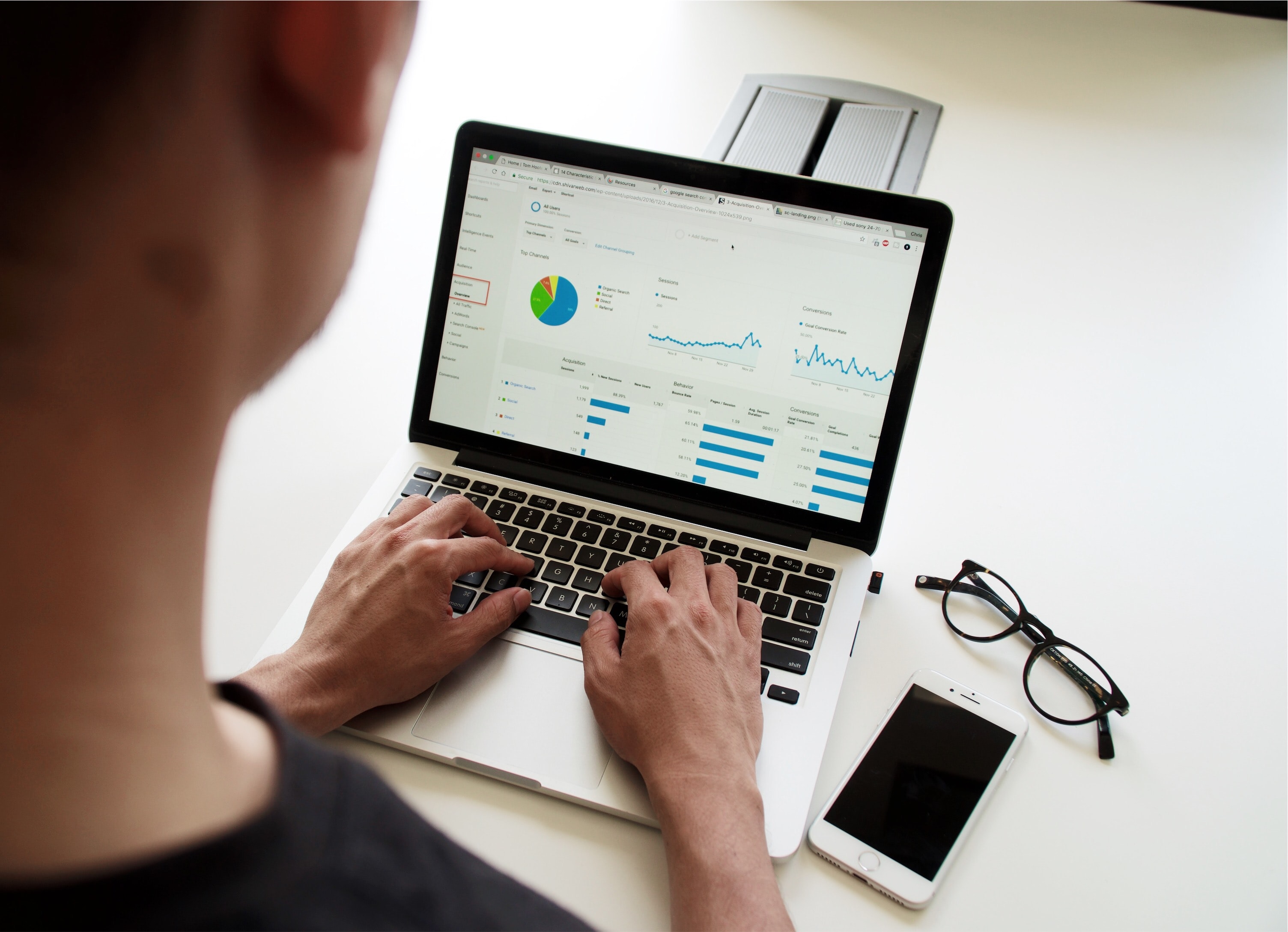Image of someone viewing data charts