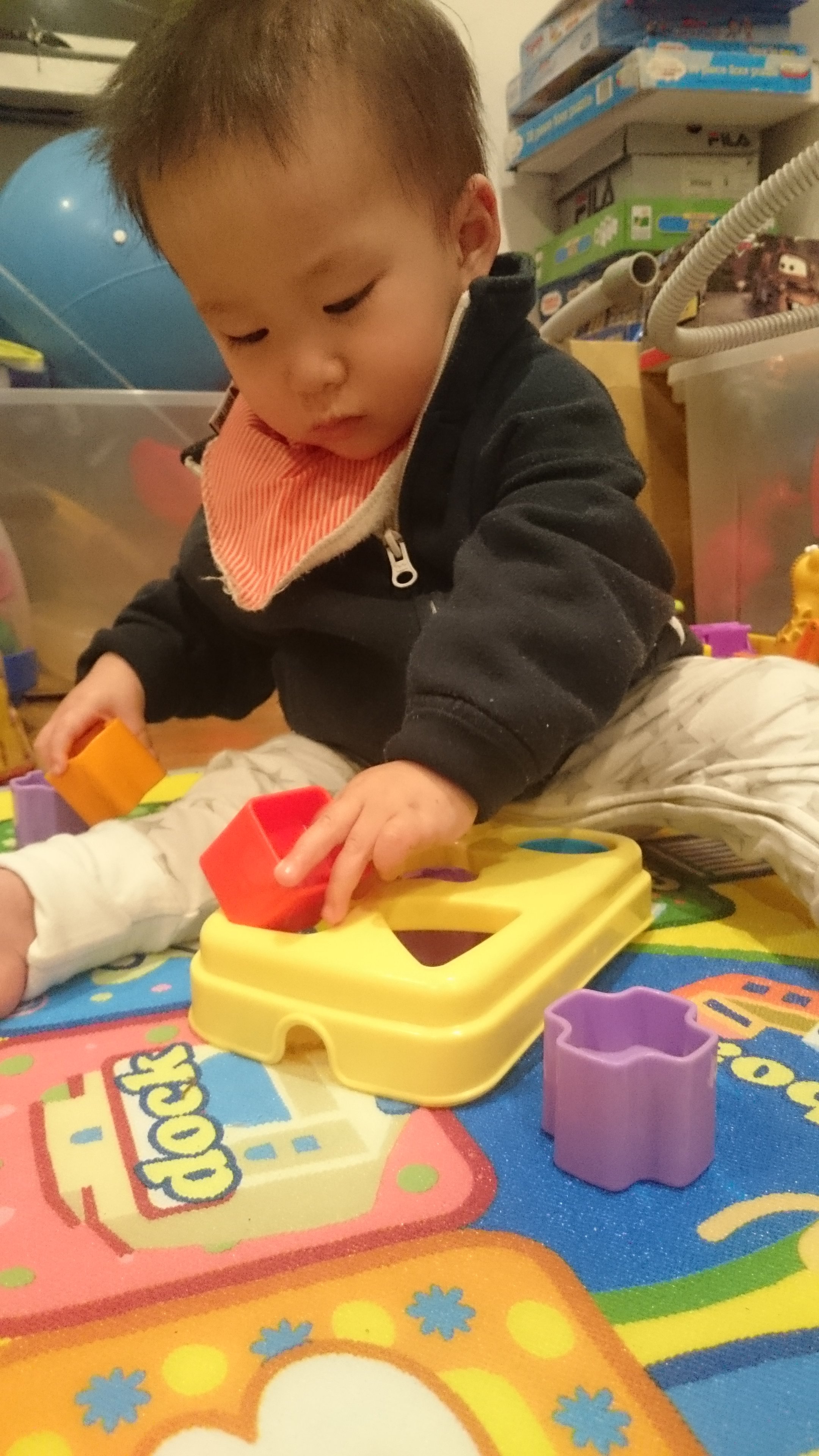 child playing with shape sorter