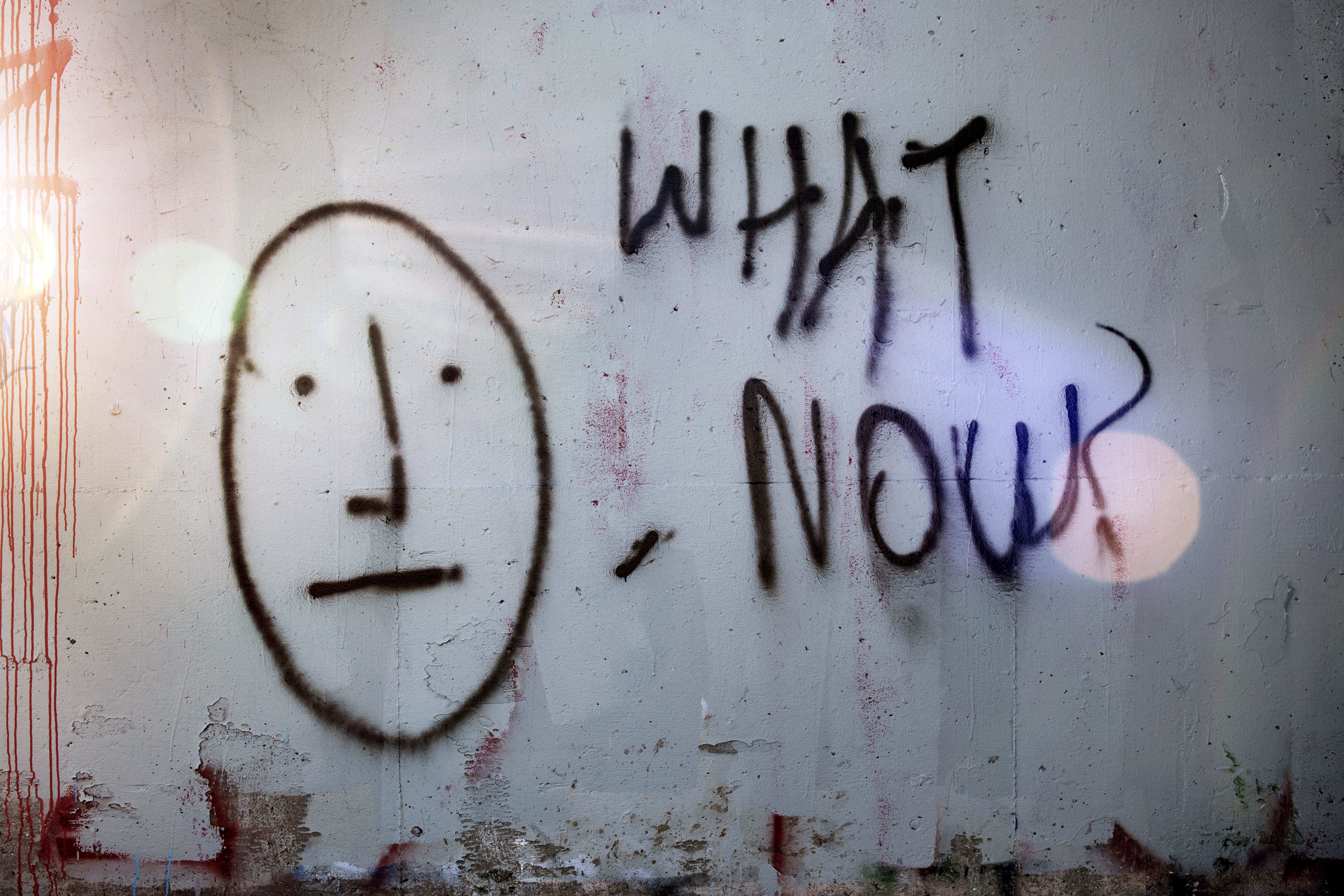 graffiti_on_a_wall_asking_what_now.jpg