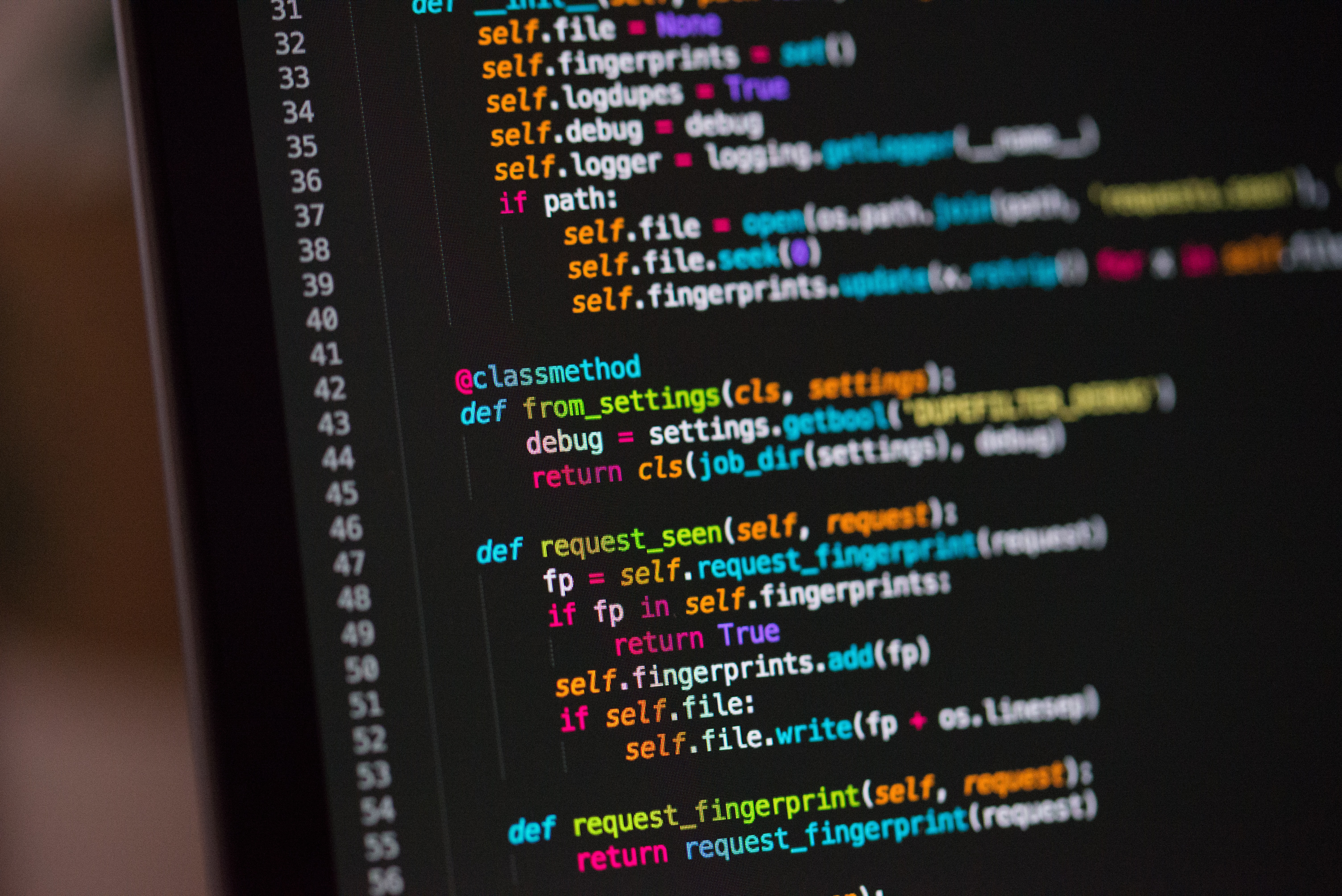 Image of a laptop with python code on display