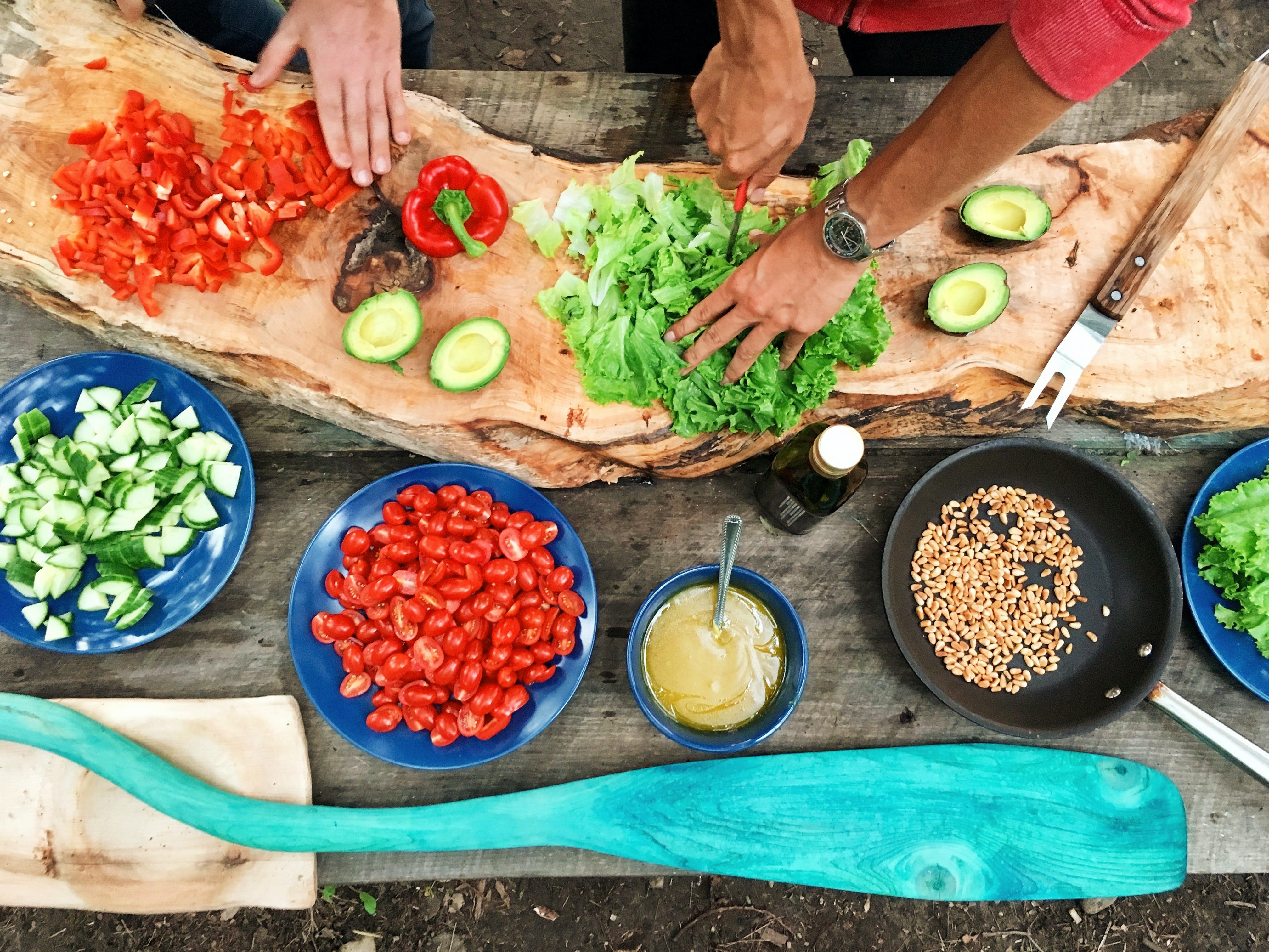 Preparing food on a chopping board with other ingredients in bowls