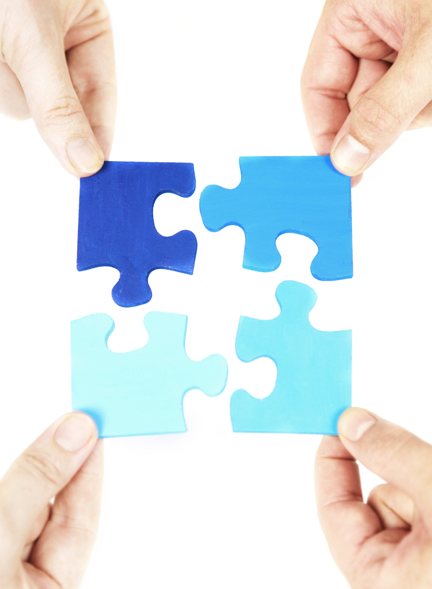 People working together to solve a puzzle