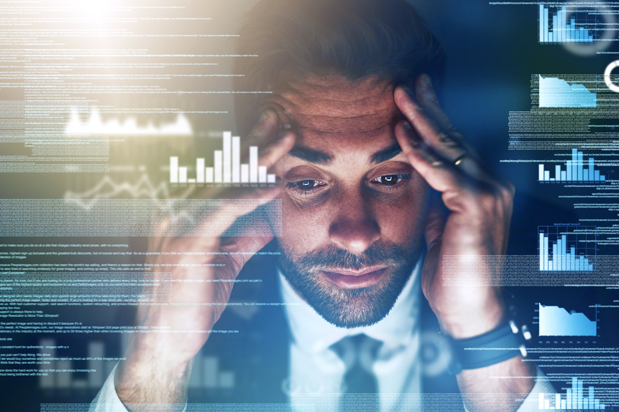 Man overwhelmed by data