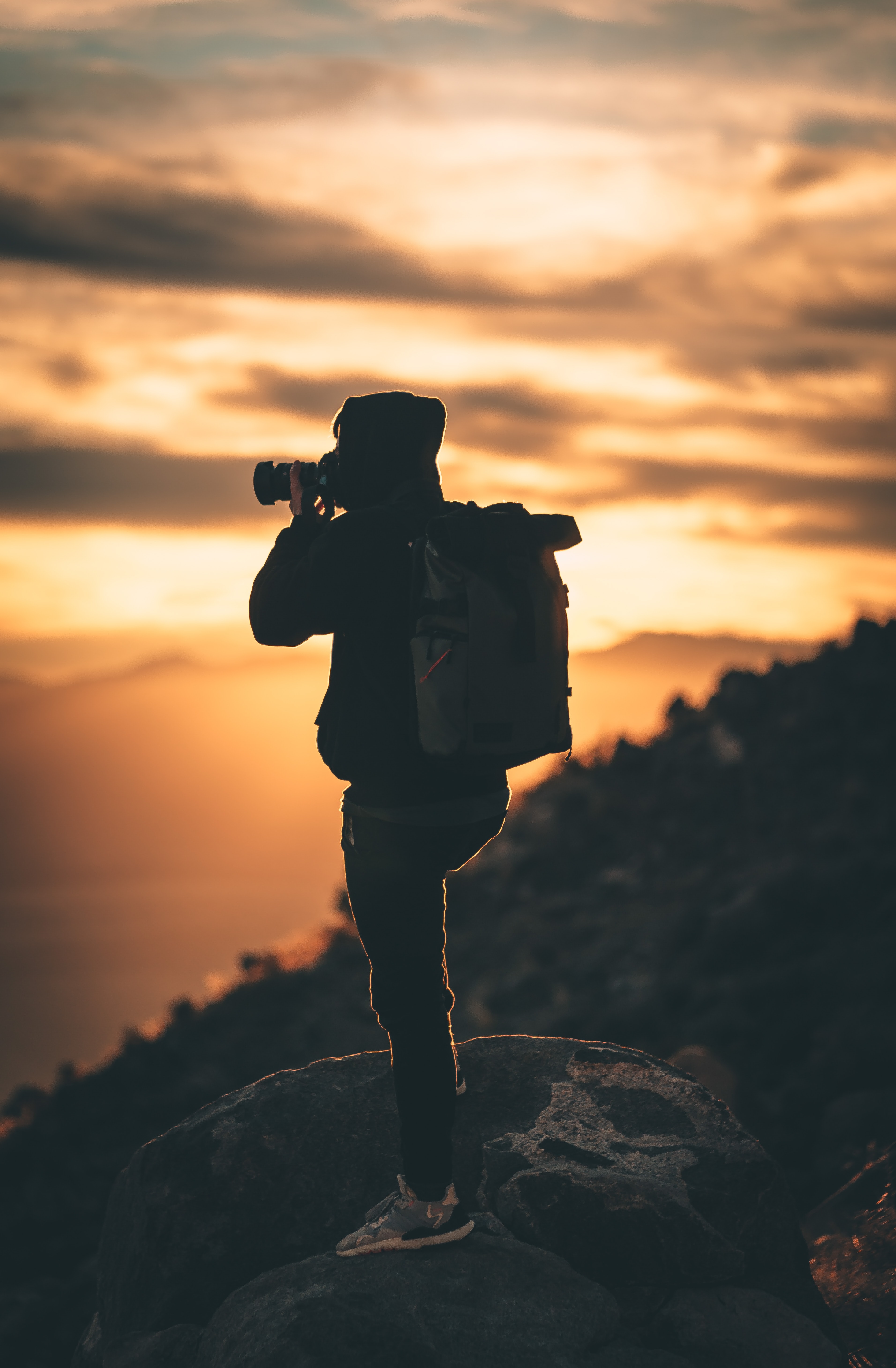 An image of person photographing a scene