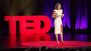 Woman presenting at a TED talk