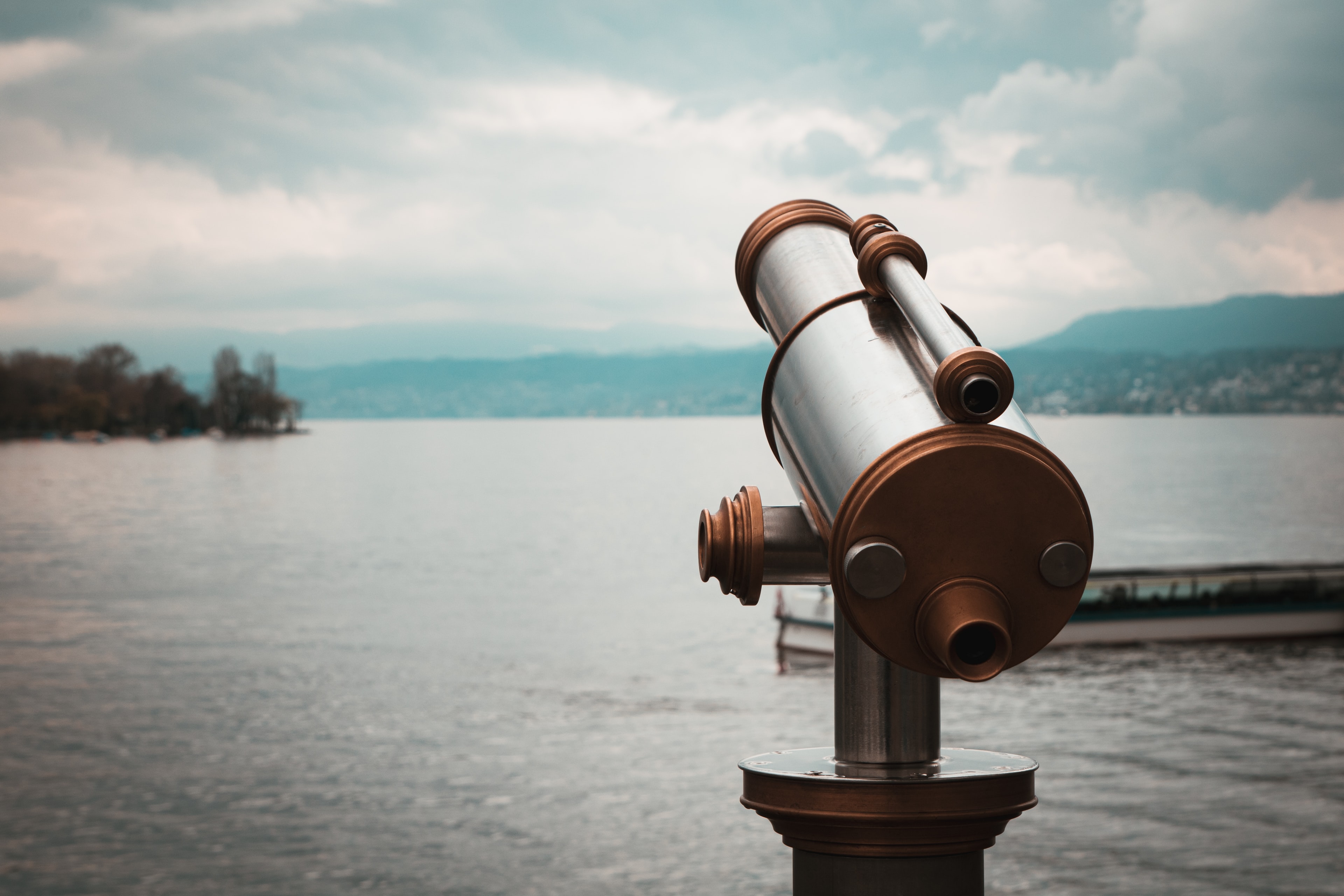 a telescope overlooks a lake