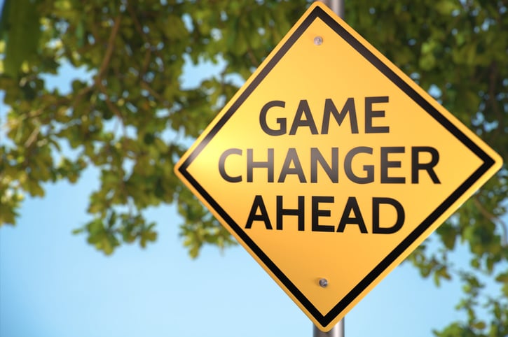 A street sign that reads game changer ahead