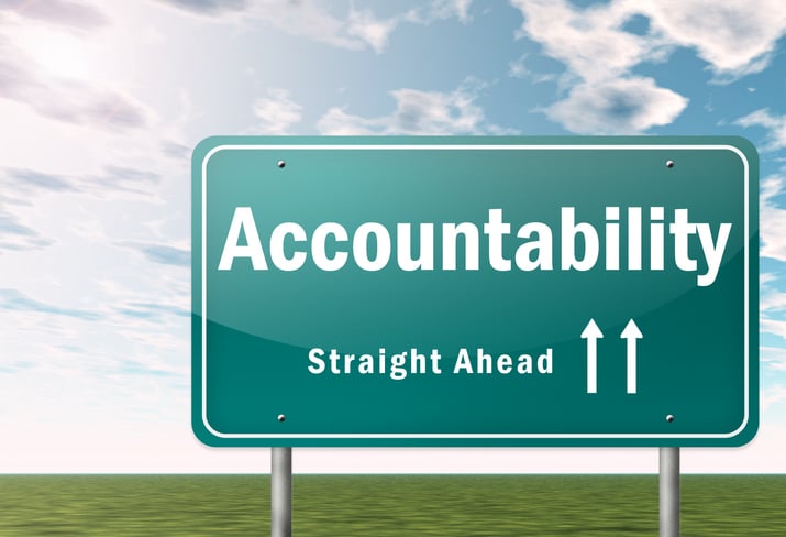 A street sign stating accountability ahead