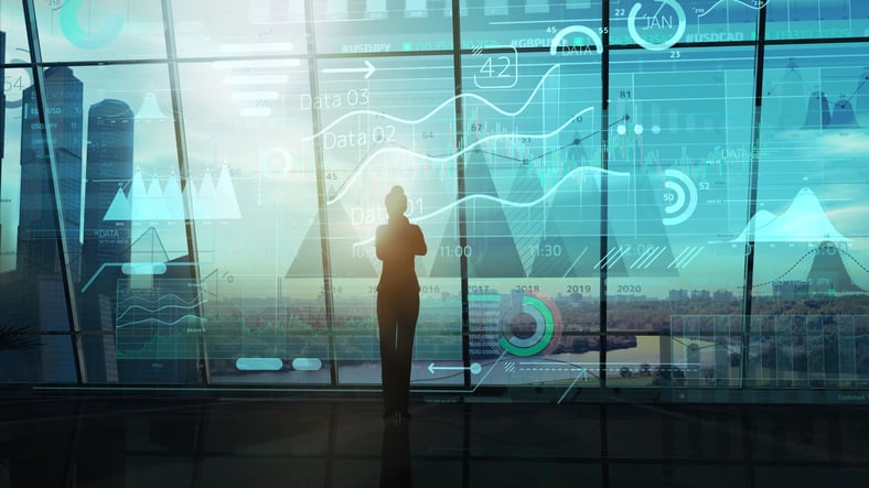 Business woman looking at a big data array