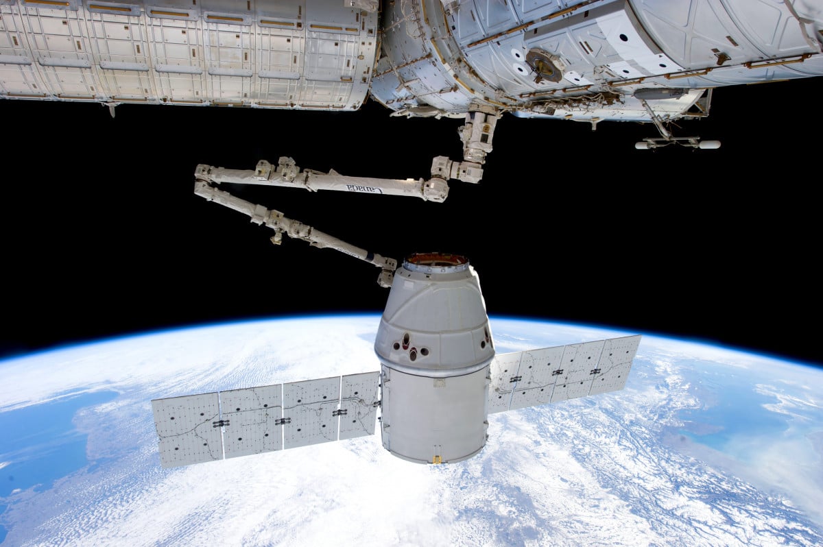 Photo of a satellite floating in space.