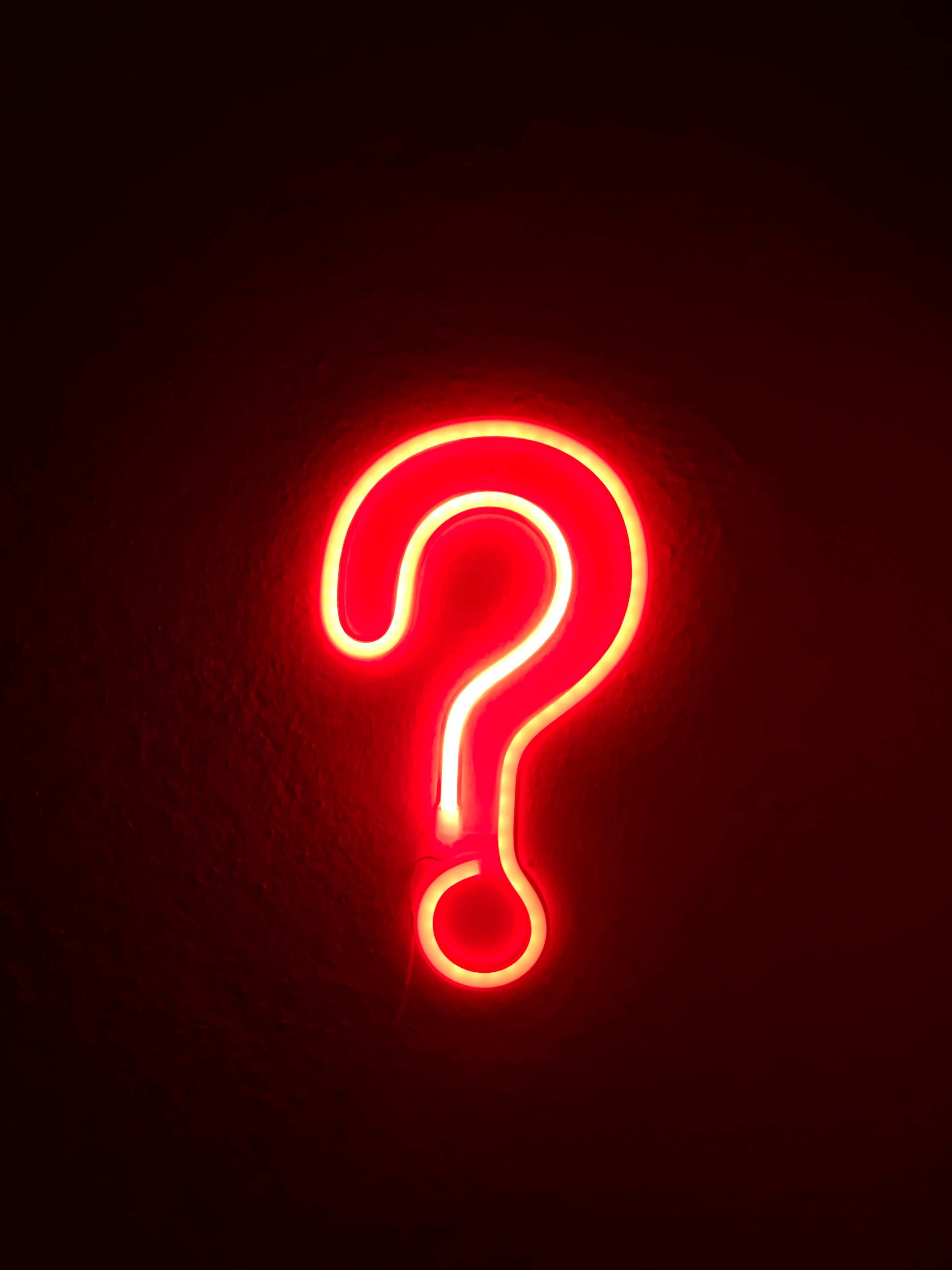 Question mark in a red neon light