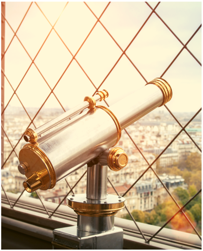 Telescope pointing to a city