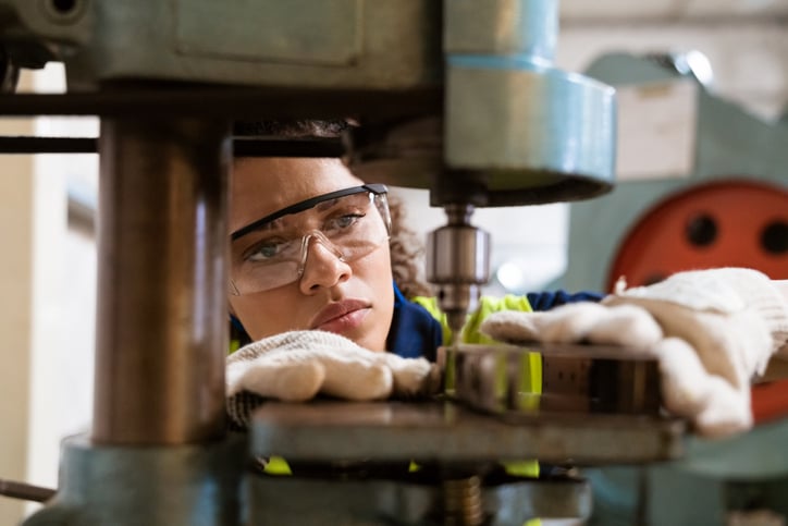 Engineer setting up tooling for manufacturing