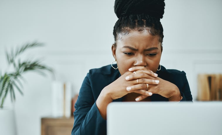 Young business woman contemplating