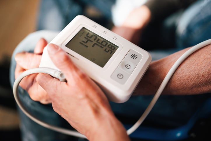 People checking blood pressure and heart rate with digital measurement