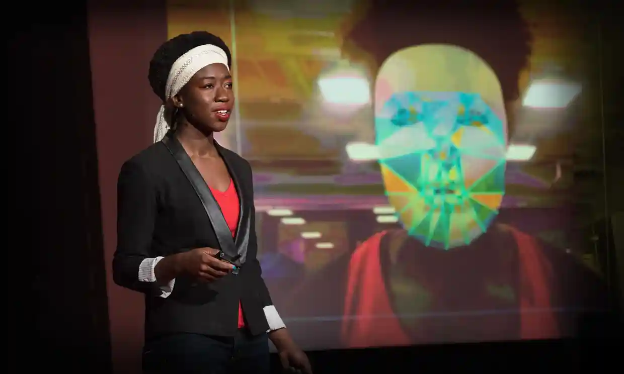 Screenshot of the Ted talk of Joy with a photo of her wearing a white mask