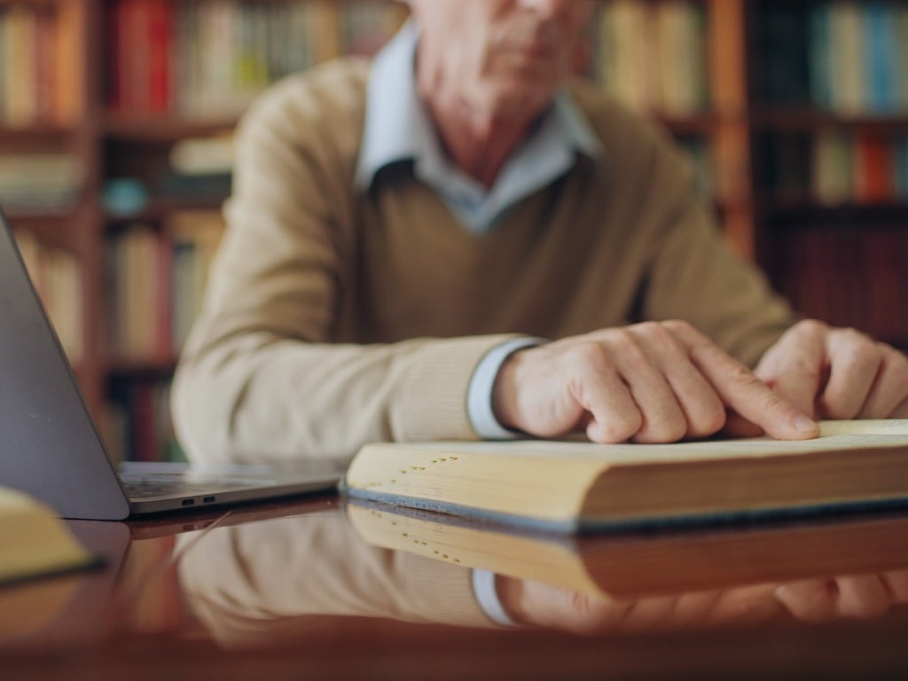 Image of a historian looking at books