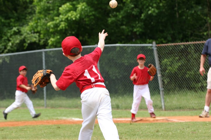 An image of an assist to get a baseball out