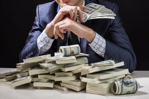 Image of a pile of man with a pile of money