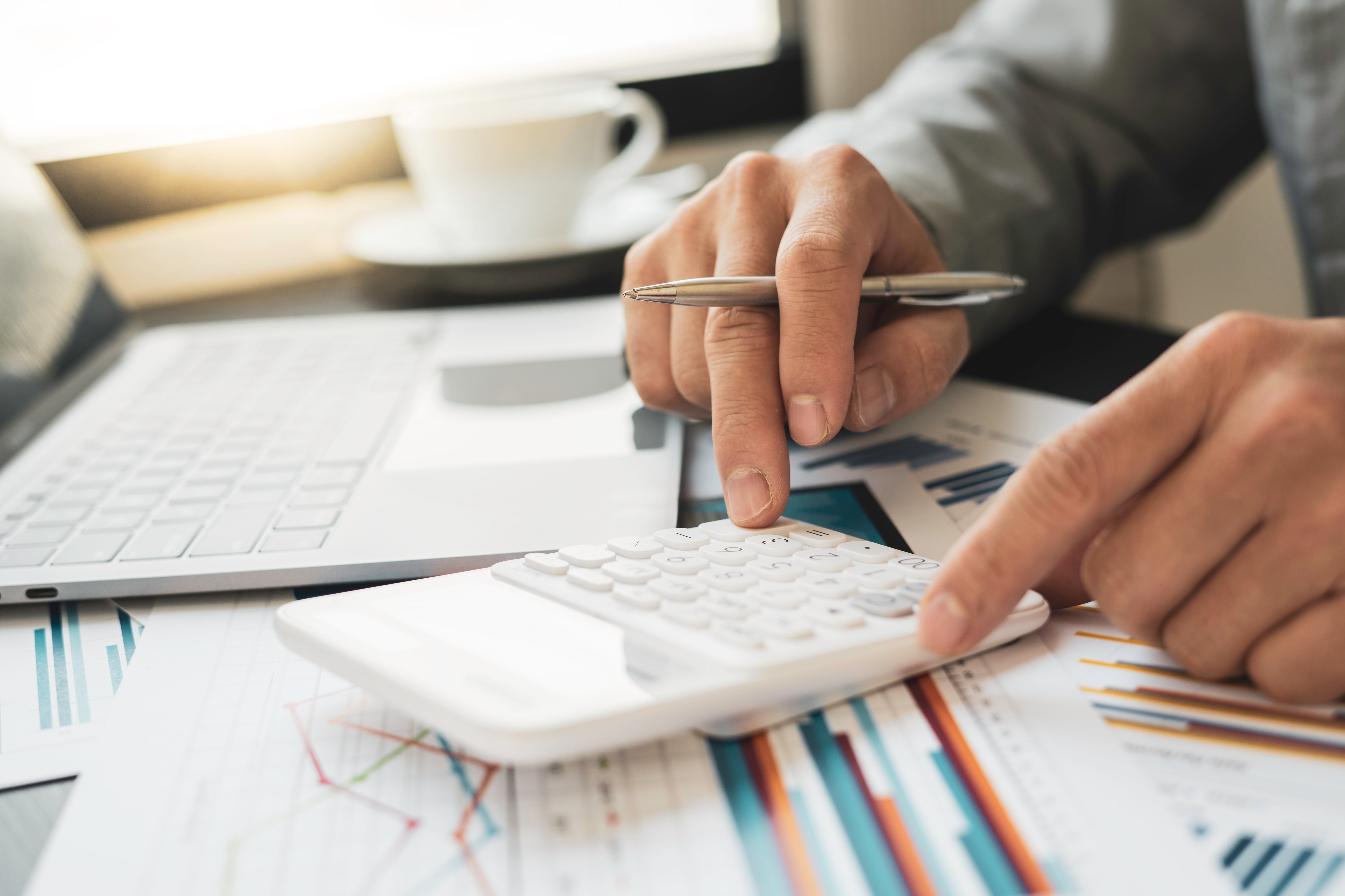 A photo of a person calculating financial information
