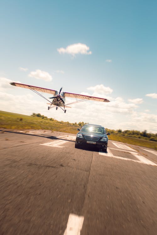 Image of a plane and a car.