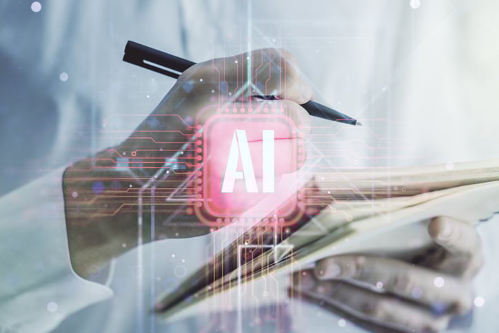 Image of a person using a pen and paper, recording viable projects for AI