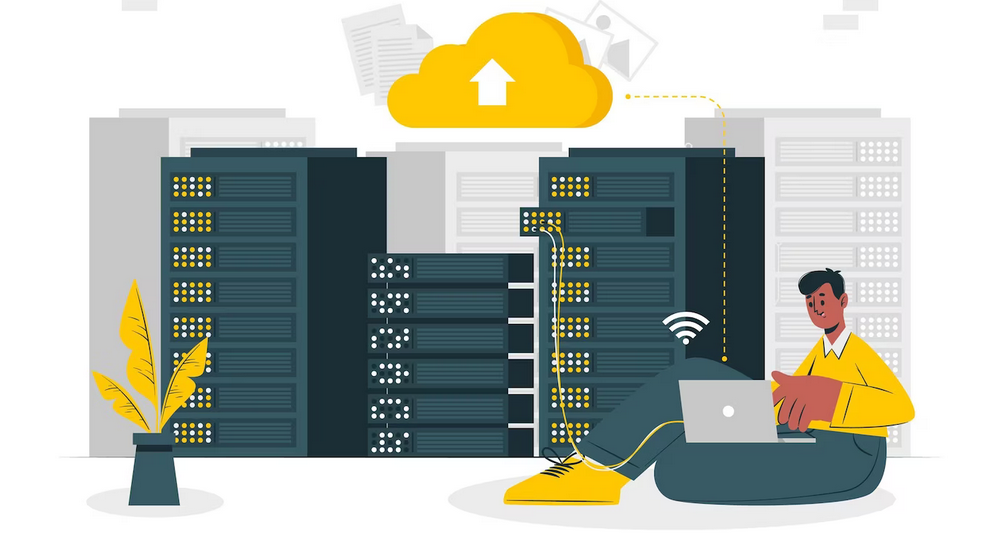 A man lounging with a laptop and databases in his background with a cloud image hovering over them, representing data storage.