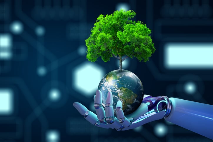 A robotic hand holding the planet Earth, with a tree growing from the top