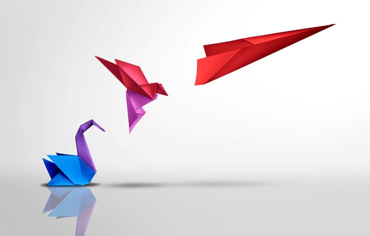 Image of a paper swan turning into a papar airplane