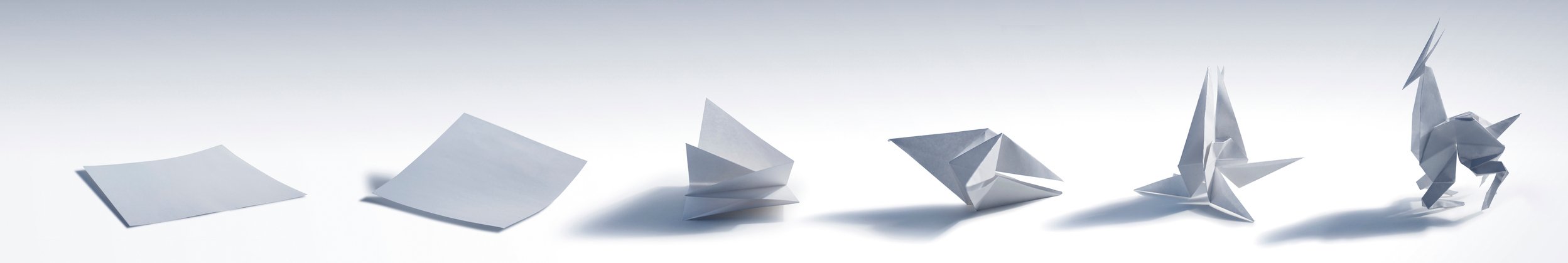 Image showing series of stages of folding paper from flat to folded into origami figure