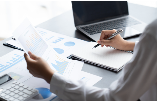 analyst reviewing financial graphs