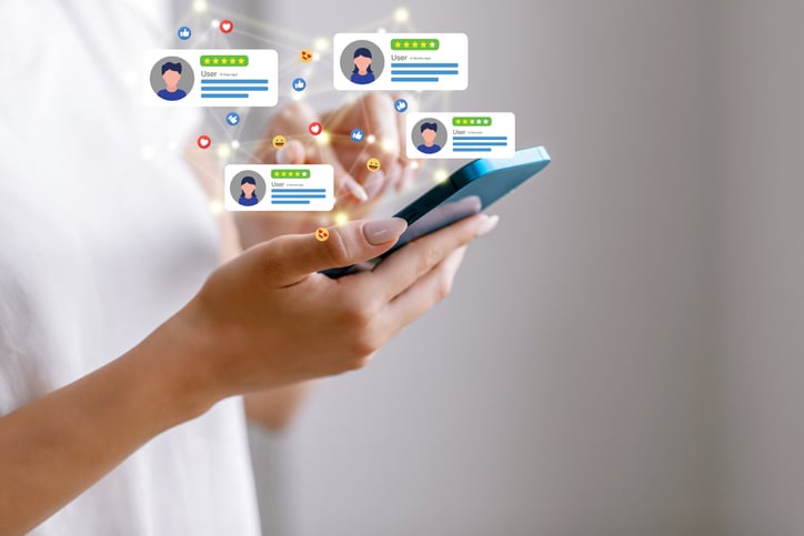 A person uses a mobile device to access social media.