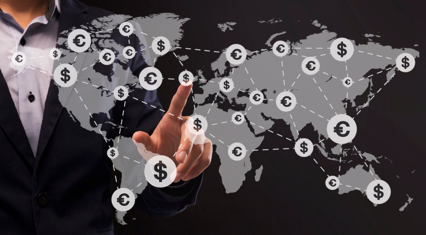 A global financial network, showing different locations, each with their own currency, connected by a network on a map.