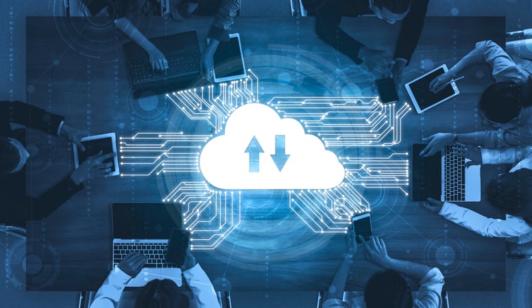 A team works on their laptops connected to the cloud.