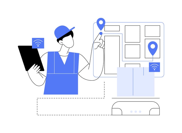 A warehouse worker checks the locations of items on his digital device.