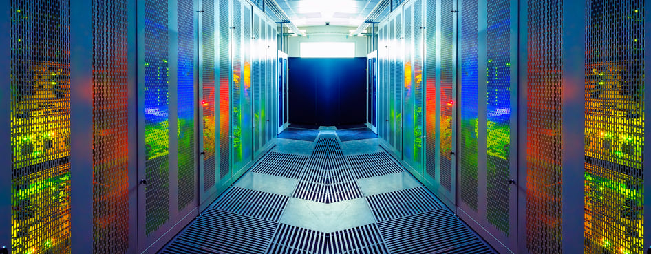An endless corridor surrounded by stacks of computers.