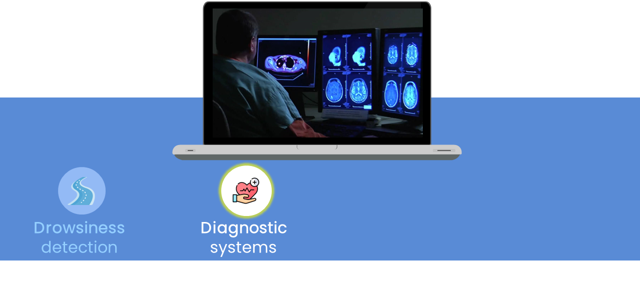 Image of a doctor looking at a monitor screen with medical images and the label diagnostic systems highlighted in yellow